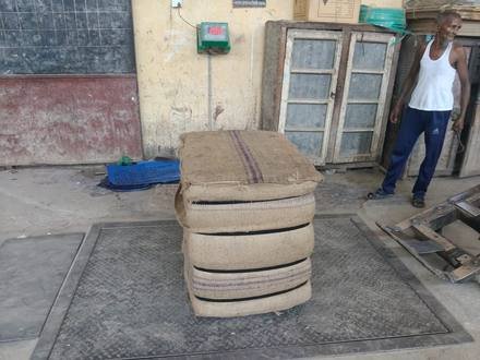 Jute bags being baled and stacked, photo 2 of 3