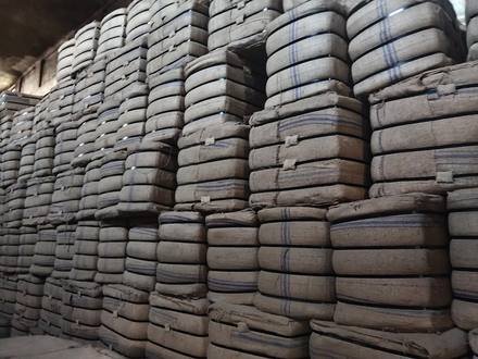 Jute bags being baled and stacked, photo 3 of 3