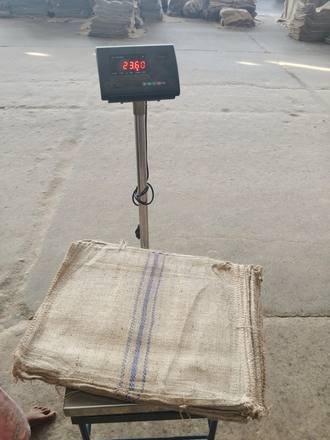 Bundle of jute bags on a platform scale, photo 1 of 4