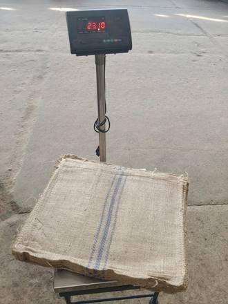 Bundle of jute bags on a platform scale, photo 2 of 4