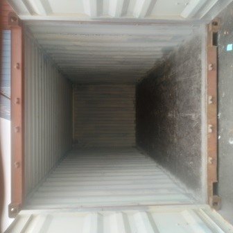 Inside an empty shipping container before loading, photo 12 of 13