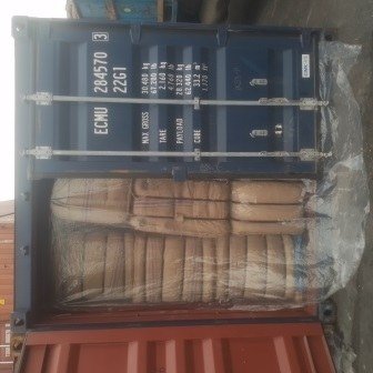 Bales of jute bags stacked inside a shipping container, photo 5 of 25