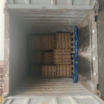 Bales of jute bags stacked inside a shipping container, photo 11 of 25