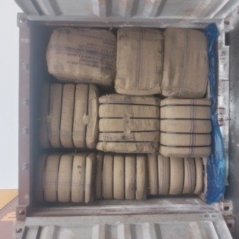 Bales of jute bags stacked inside a shipping container, photo 17 of 25