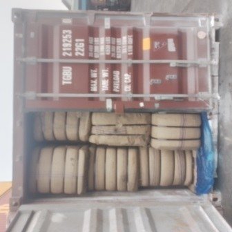 Bales of jute bags stacked inside a shipping container, photo 18 of 25