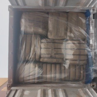 Bales of jute bags stacked inside a shipping container, photo 19 of 25