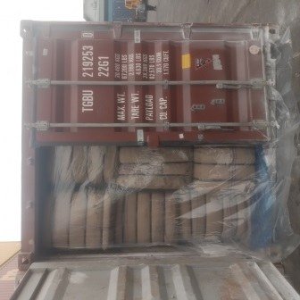 Bales of jute bags stacked inside a shipping container, photo 20 of 25