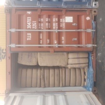 Bales of jute bags stacked inside a shipping container, photo 21 of 25