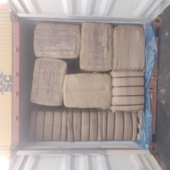Bales of jute bags stacked inside a shipping container, photo 22 of 25