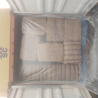 Bales of jute bags stacked inside a shipping container, photo 23 of 25