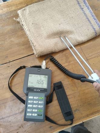 Moisture meter checking a jute bag, photo 3 of 4