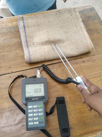 Moisture meter checking a jute bag, photo 4 of 4