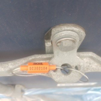 Container doors closed with a numbered seal, photo 2 of 10