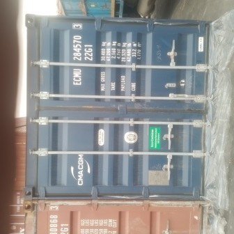 Container doors closed with a numbered seal, photo 6 of 10