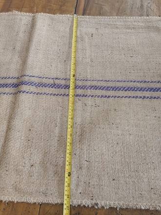 Measuring a jute bag with a tape, photo 7 of 21