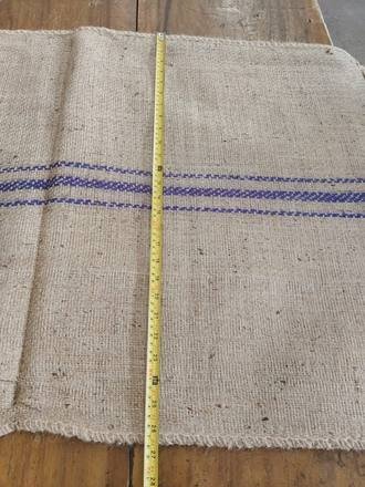 Measuring a jute bag with a tape, photo 12 of 21