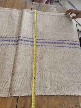 Measuring a jute bag with a tape, photo 14 of 21