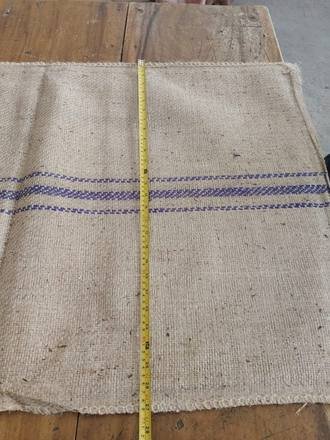 Measuring a jute bag with a tape, photo 15 of 21