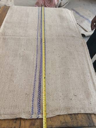 Measuring a jute bag with a tape, photo 17 of 21