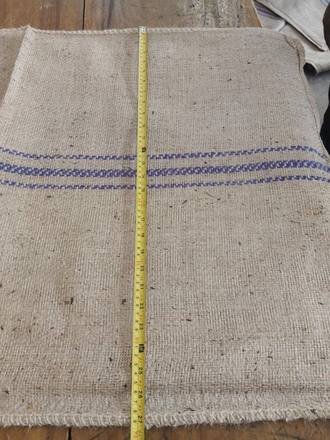 Measuring a jute bag with a tape, photo 18 of 21