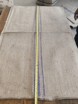Measuring a jute bag with a tape, photo 19 of 21