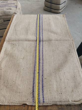 Measuring a jute bag with a tape, photo 20 of 21