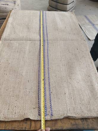 Measuring a jute bag with a tape, photo 21 of 21
